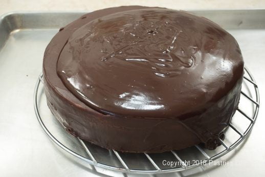 Glaze poured onto cake for the Viennese Chocolate Punchtorte