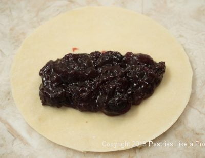 Filling on pastry for Sweet Cherry Calzones