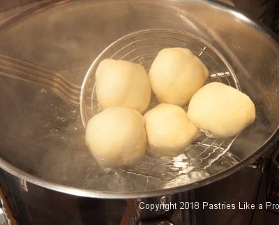 Dumplings going into water for Plum Dumplings