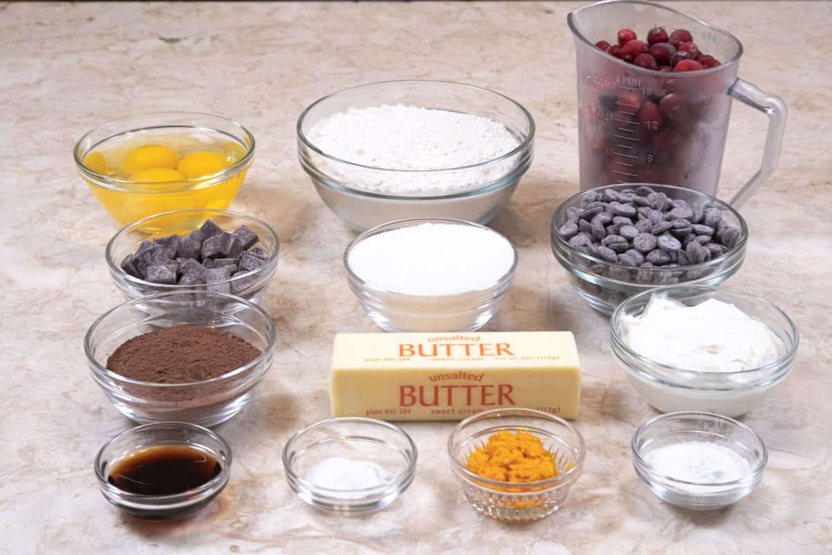 The ingredients for the Chocolate Cranberry Bread include, semisweet chocolate, unsalted butter, cranberries, all-purpose flour, cocoa, baking power, baking soda ,eggs, granulated sugar, orange zest, sour cream, vanilla, chocolate chunks.