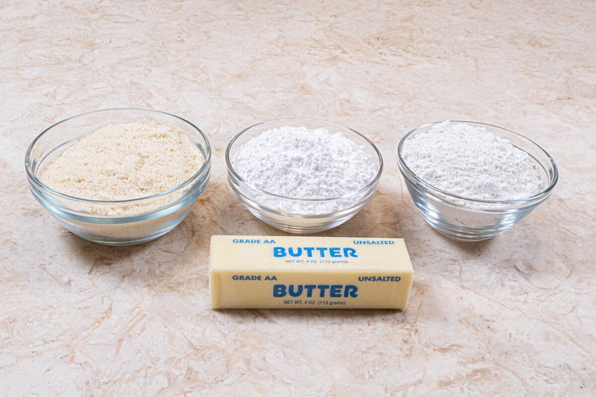 Ingredients for the Baci di Dama cookies include hazelnut flour, cake flour, powdered sugar and unsalted butter.