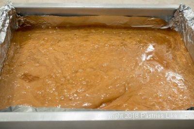 Toffee poured in pan for Salted Macadamia Rum Toffee, Rum Toffee Recipe