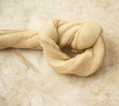 Partially tied dough for Cardamom Yeast Rolls