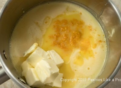 Butter, orange zest added to Orange Curd