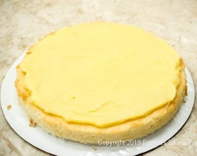 Lemon curd on first layer of cake