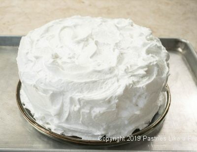 Lemon Meringue Cake covered with meringue