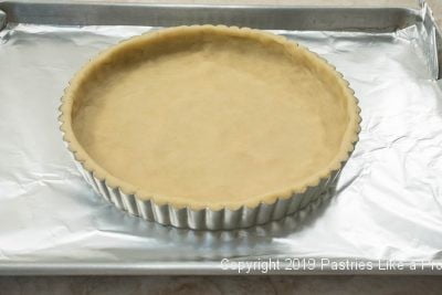 Pan with crust on rimmed baking sheet