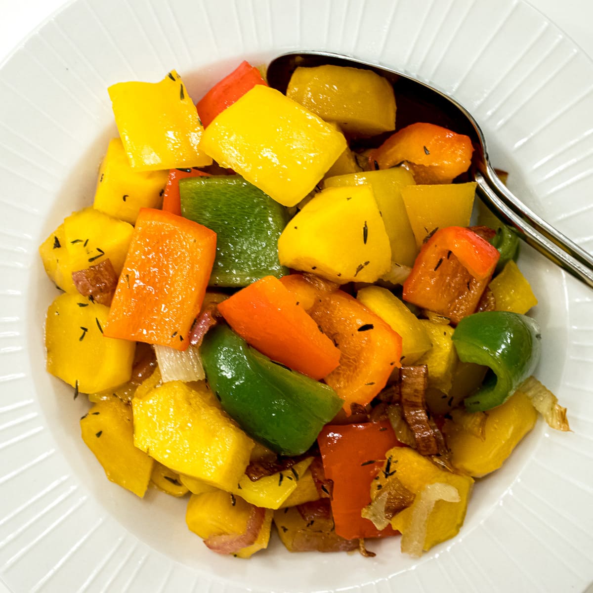 Sweet potatoes, squash green and red  peppers and red onions roasted in a  honey and thyme