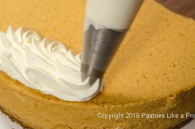Piping whipping cream on