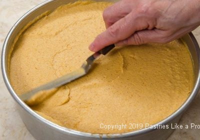 Smoothing top of Pumpkin Mousse Torte