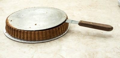 Releasing the bottom of the tart pan