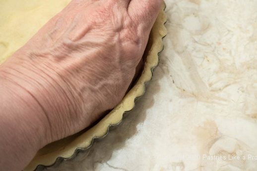 Pressing dough in for the Almond Rasperry Tart