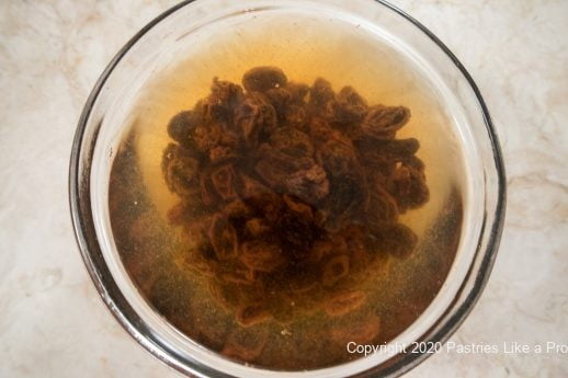 Soaking raisins for Cuccidati Coffeecake filling