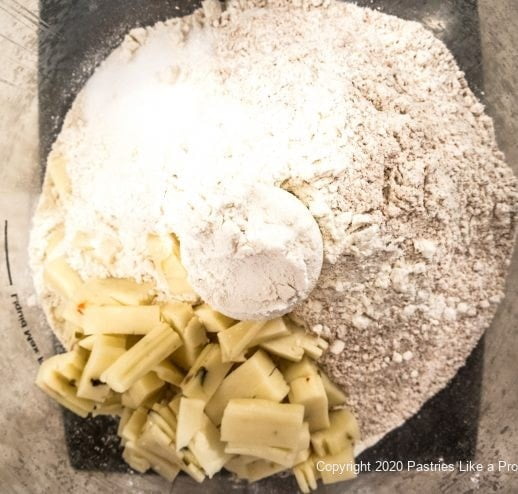 Flour, cheese, and salt in processor bowl