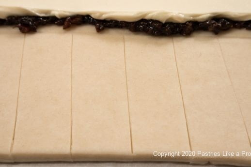 Cutting side strips for Mincemeat Cream Cheese Danish