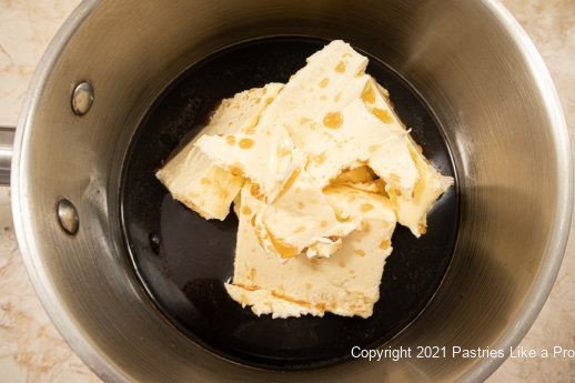 Guinness and butter in pan