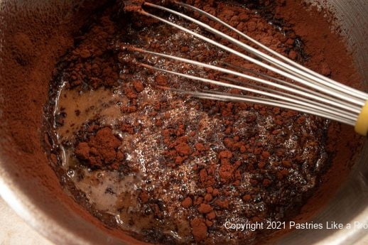 Whisking in cocoa and sugar