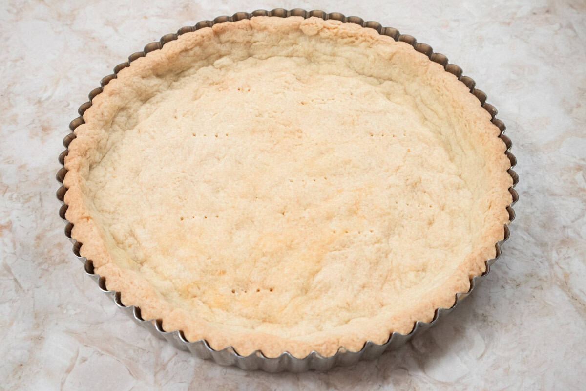 This is a photo of the baked press in tart shell for the Caramelized Peach Tart.