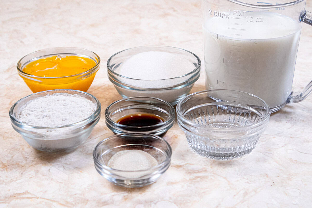 Ingredients for the Pastry Cream include milk, egg yolks, granulated sugar, flour, vanilla and heavy cream. 