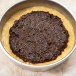 Spread the cooled filling to within ¾ inch of the sides of the pan for the Gateau Breton