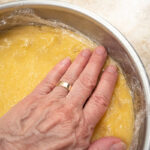 Pressing the dough into the bottom of the pan for the Gateau Breton