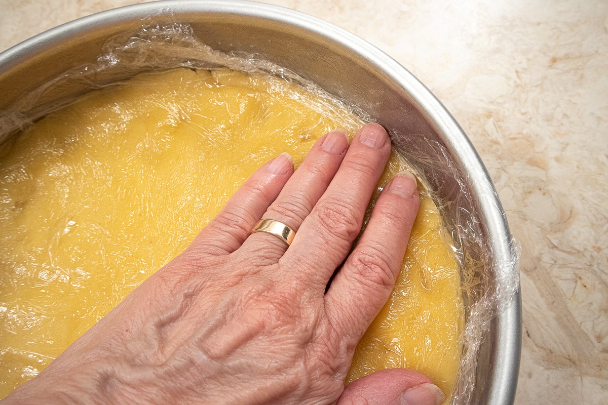 Pressing the dough into the bottom of the pan