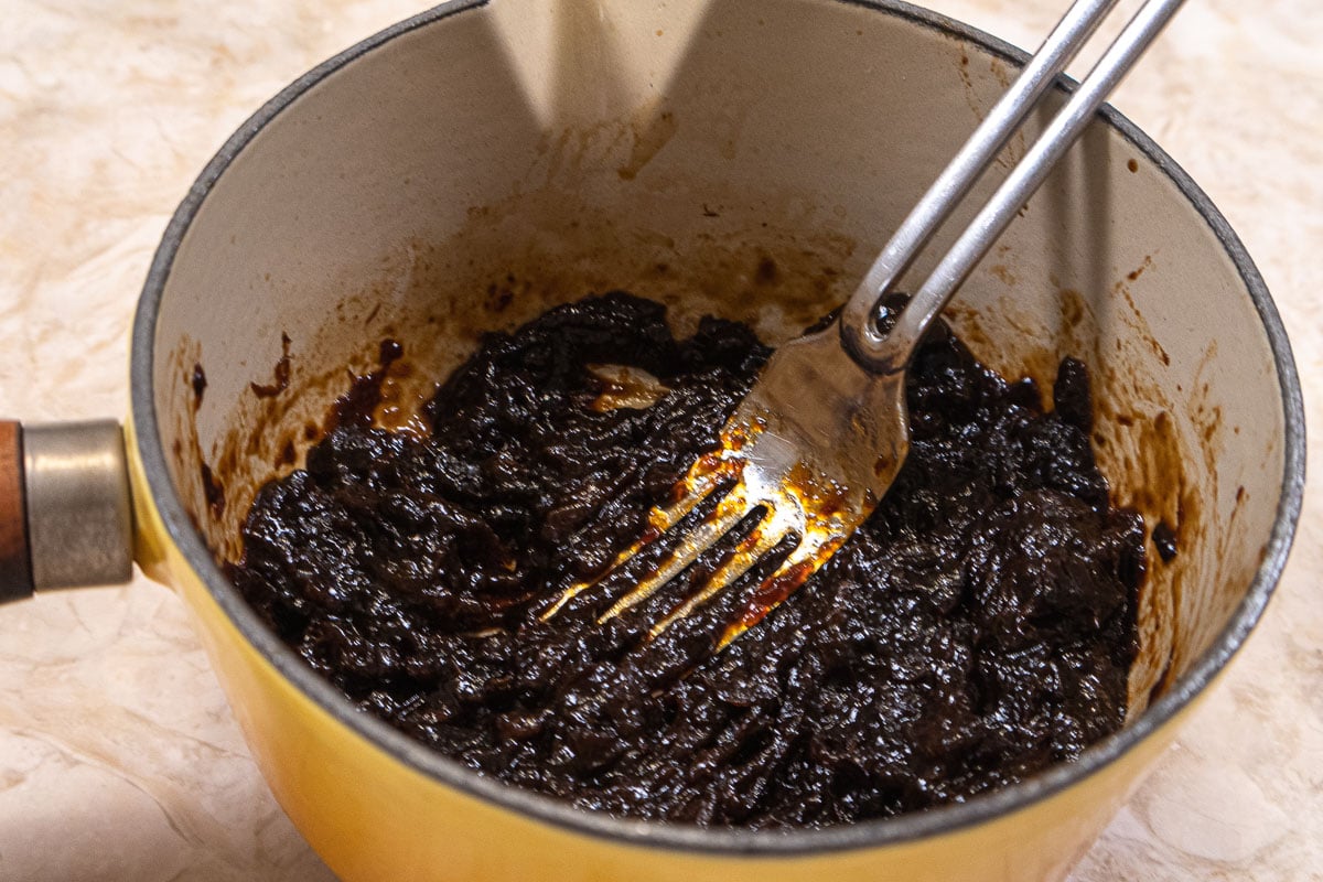 Mashing the prunes after cooking
