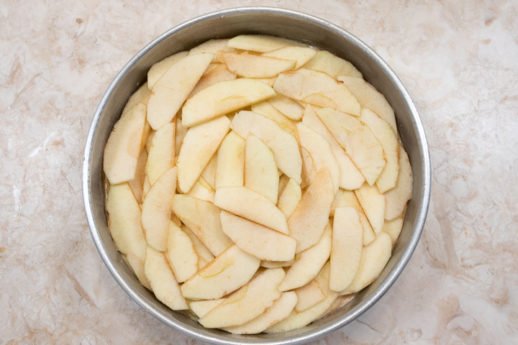 Apples spread over the batter.