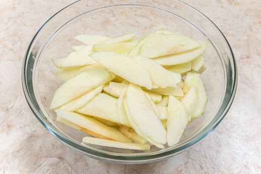 Sliced apples in a bowl for the Irish Apple Cake