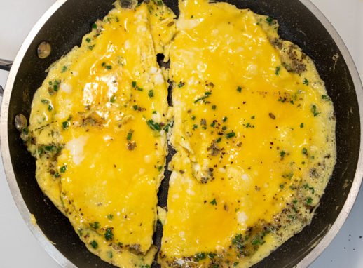 Omelet cut in half for Tourte Milanese
