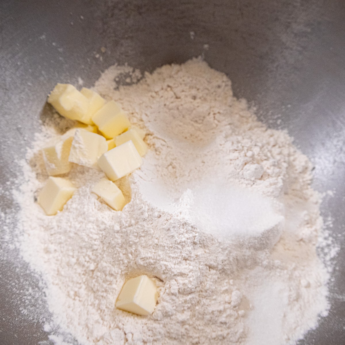 Flour, salt and butter in mixing bowl for Plum dumplings