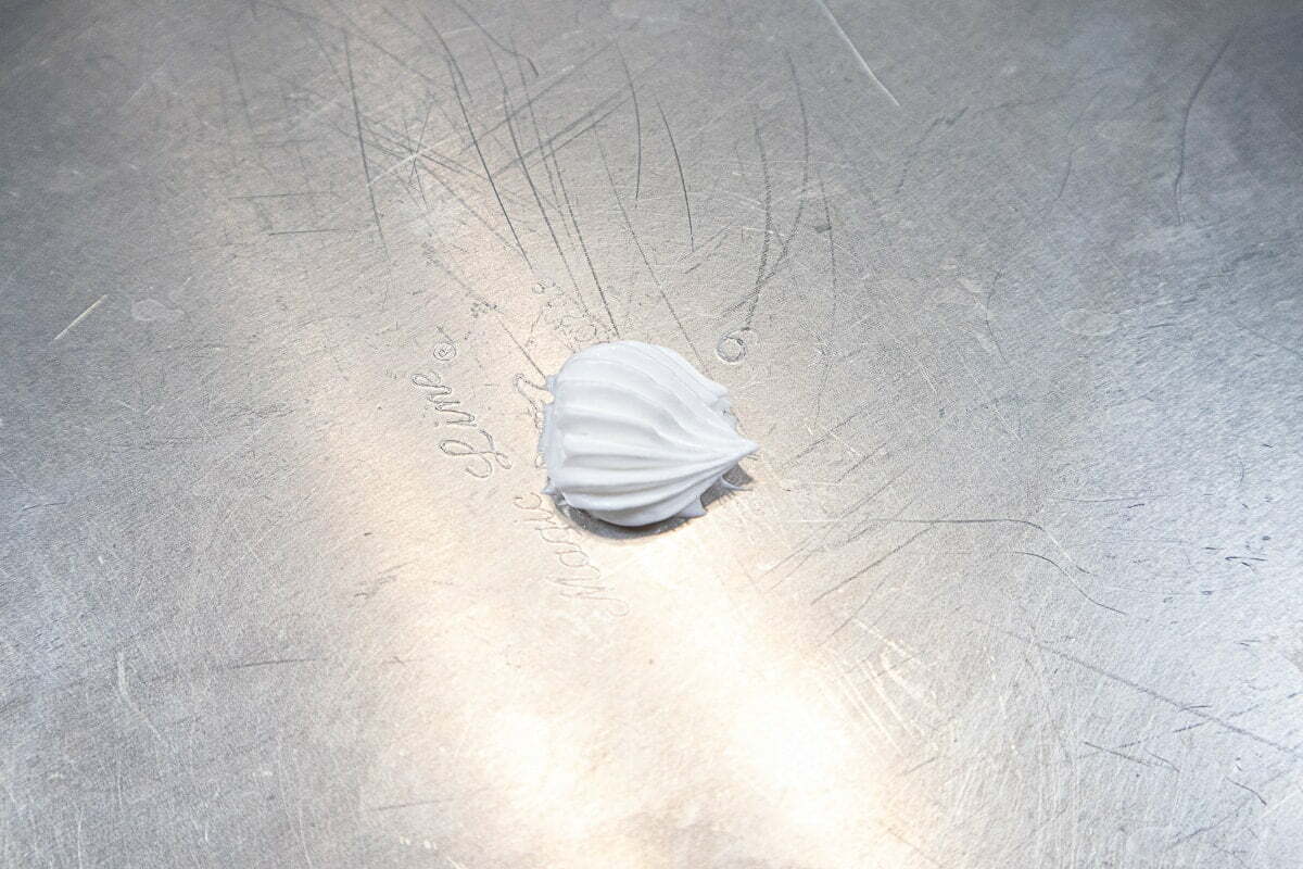 Dot of meringue on work surface to secure ice cream