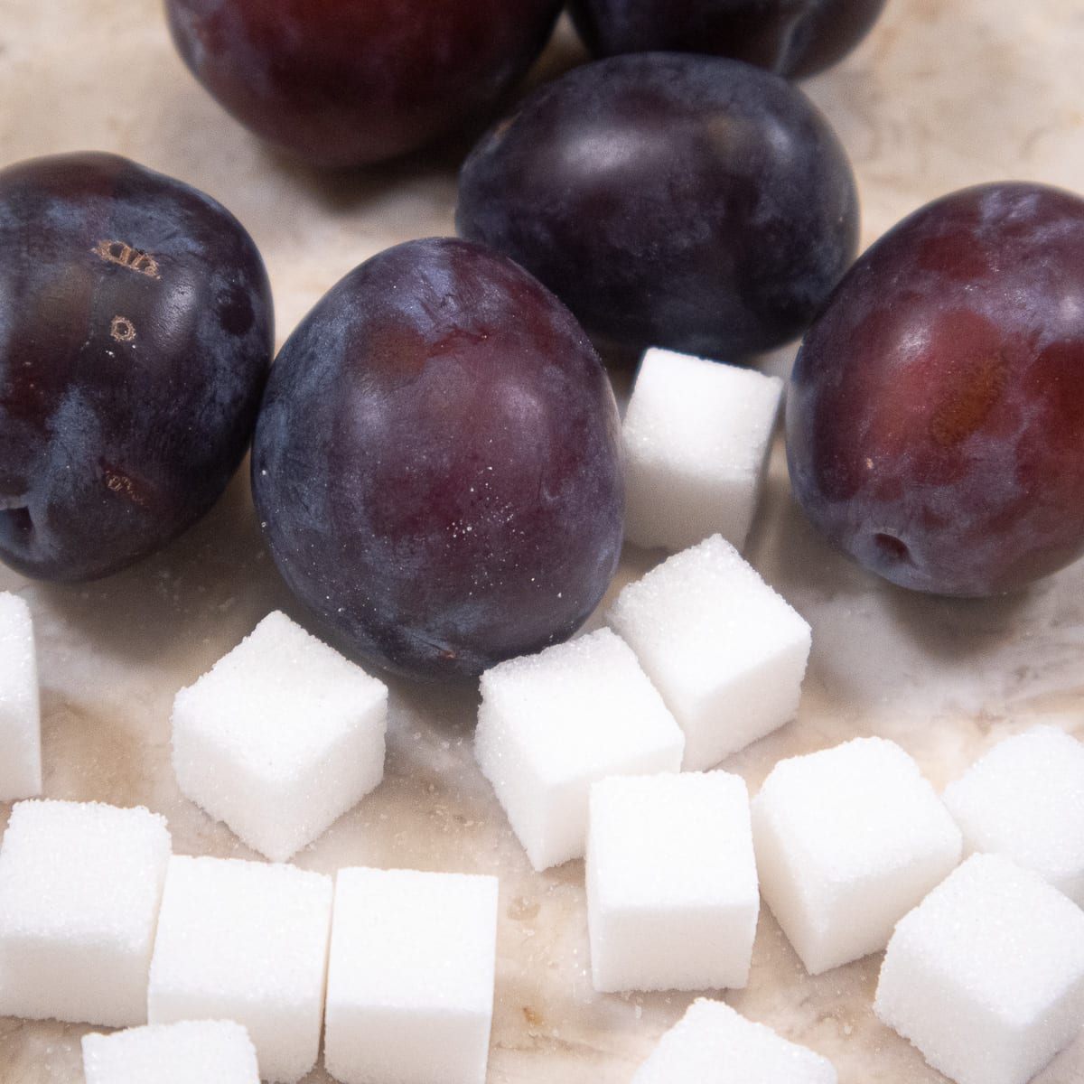 Plums and sugar cubes