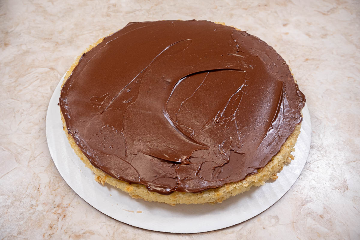 Chocolate Hazelnut Buttercream spread on bottom layer of cake