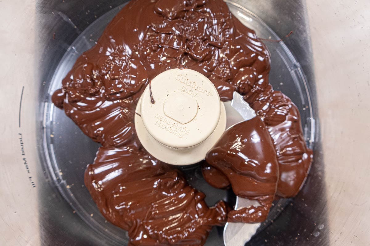 Melted chocolate in processor bowl for the buttercream