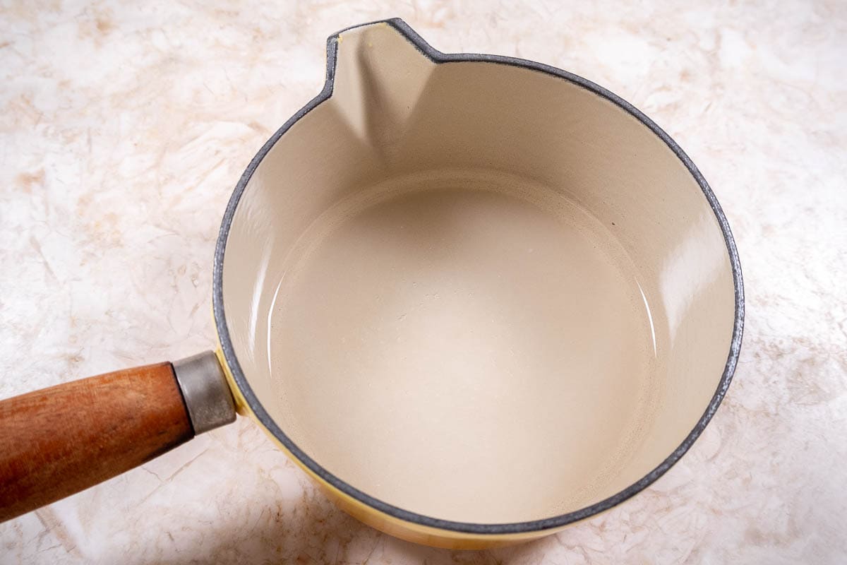 Water and sugar in small pan for Coffee Syrup