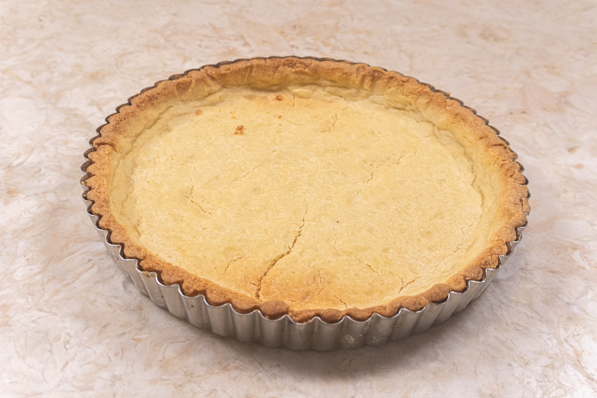 The Pate sucree crust is baked in a tart pan with a removable bottom