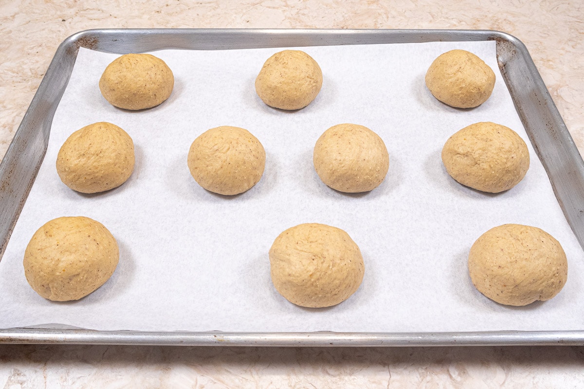 10 Pumpkin Dinner Rolls on a sheet tray