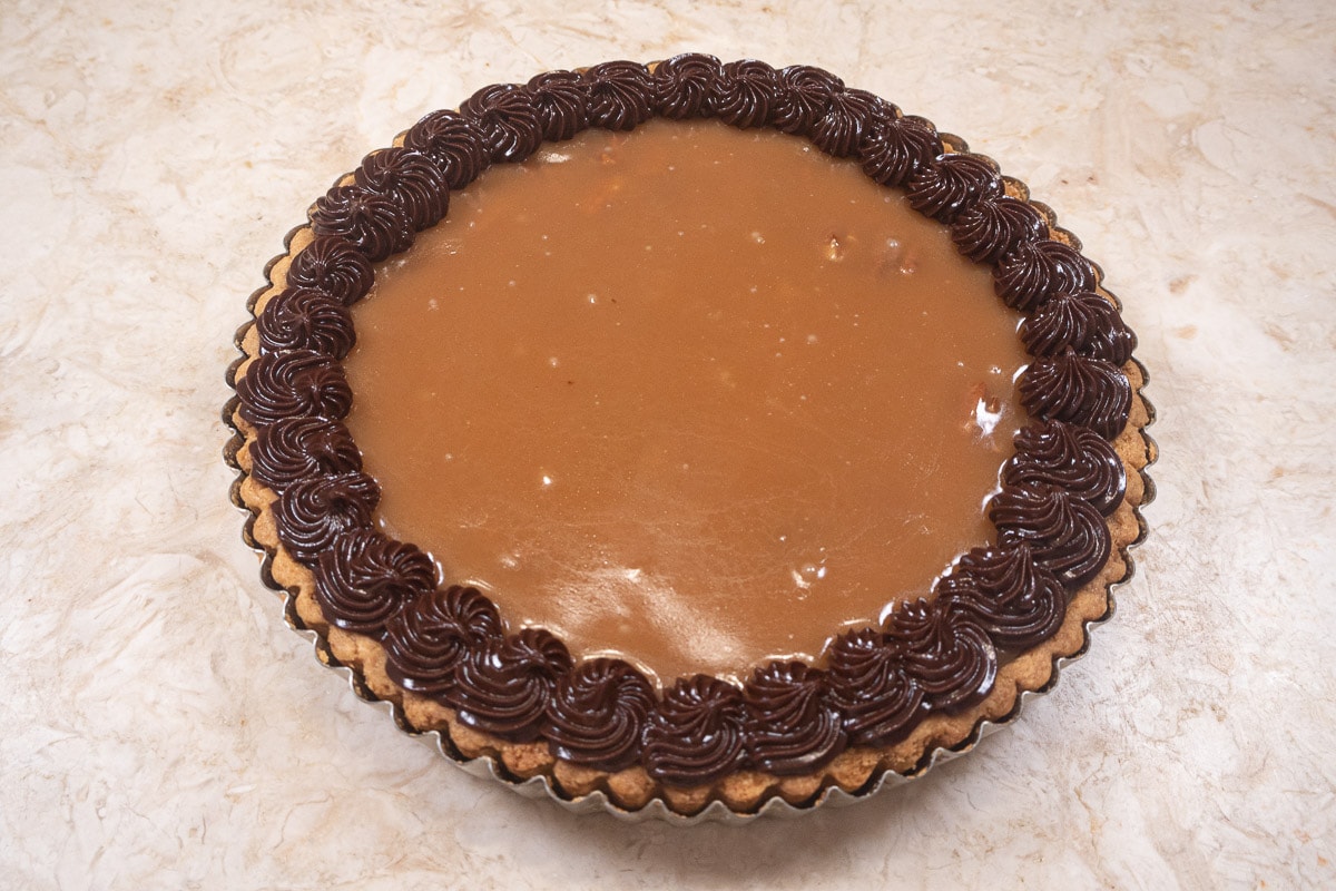 The Chocolate Caramel Pecan Tart completely edged.  Refrigerate  to set.