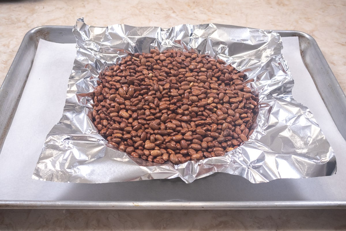 Weighted crust on rimmed baking sheet for easy handling.