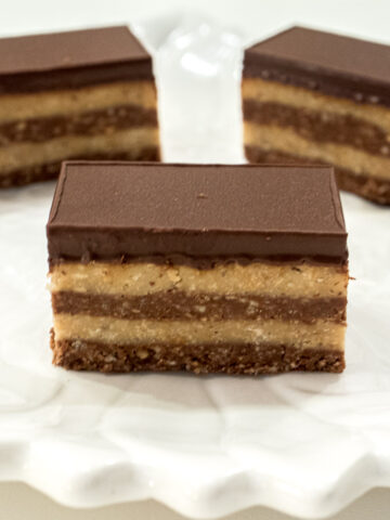 This Bajadera, a no bake bar, consists of a cookie and nut base in alternate layers of plain and chocolate finished with a chocolate glaze.