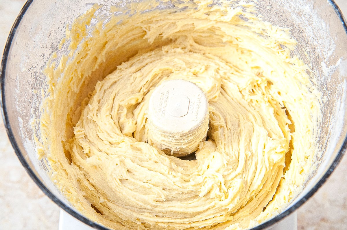 The ingredients are processed continuously until a batter is formed.