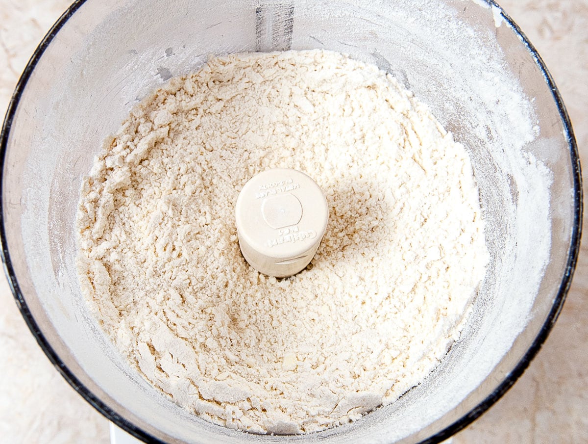 The butter and flour mixture is processed until the butter is indistinguishable. 