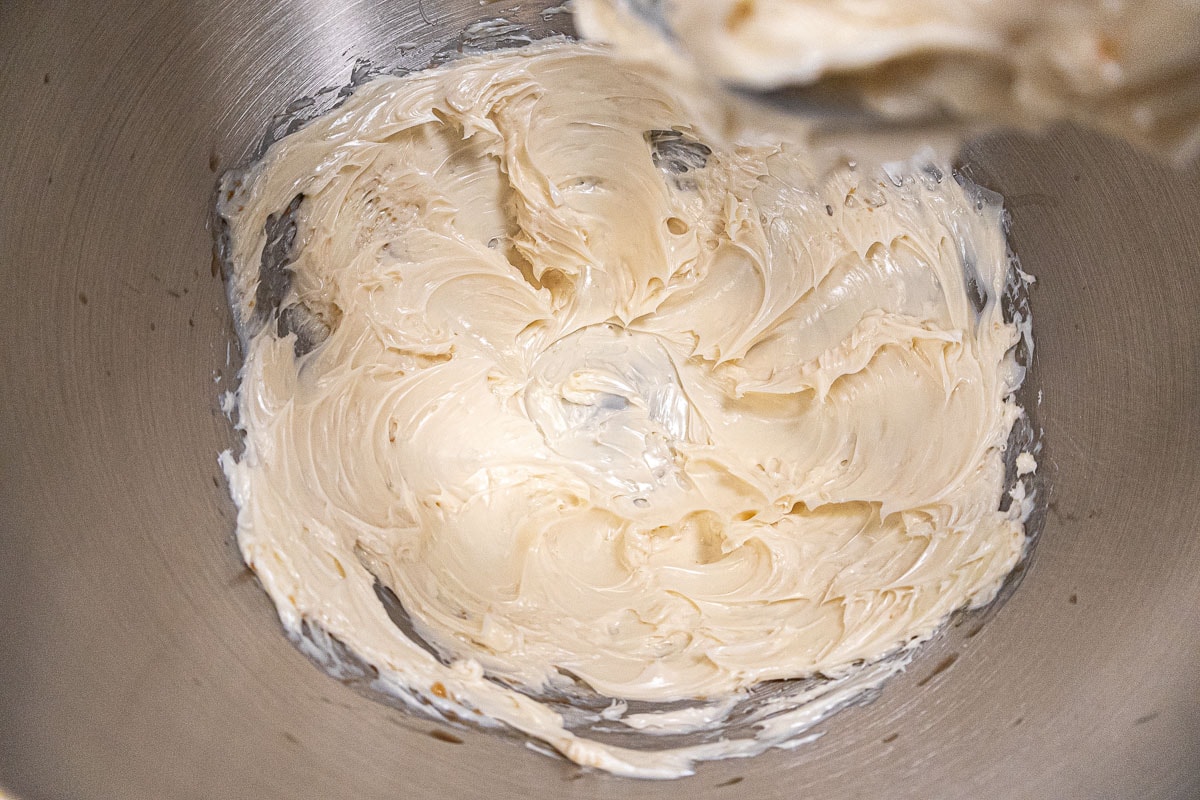 The butter and vanilla are beaten until very creamy.