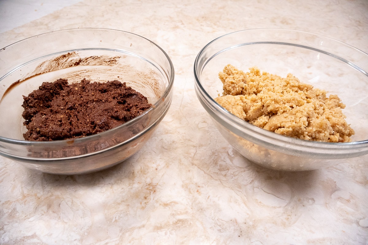 The melted chocolate is added to the bowl with less plain dough in it.  