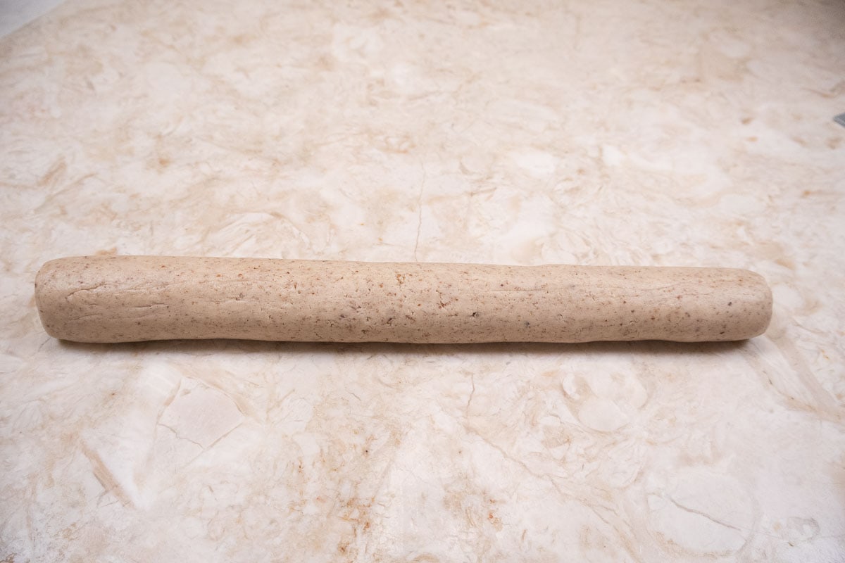 Each half of the dough is rolled into a log.