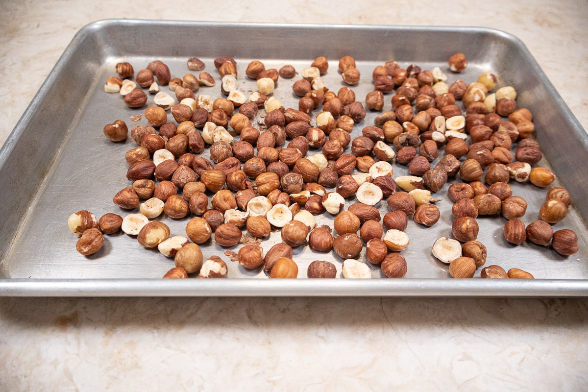 Hazelnuts on a tray ready to be toasted.