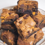 A fudgy brownie on the bottom with a chocolate and butterscotch chip cookie on top.