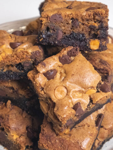 A fudgy brownie on the bottom with a chocolate and butterscotch chip cookie on top.