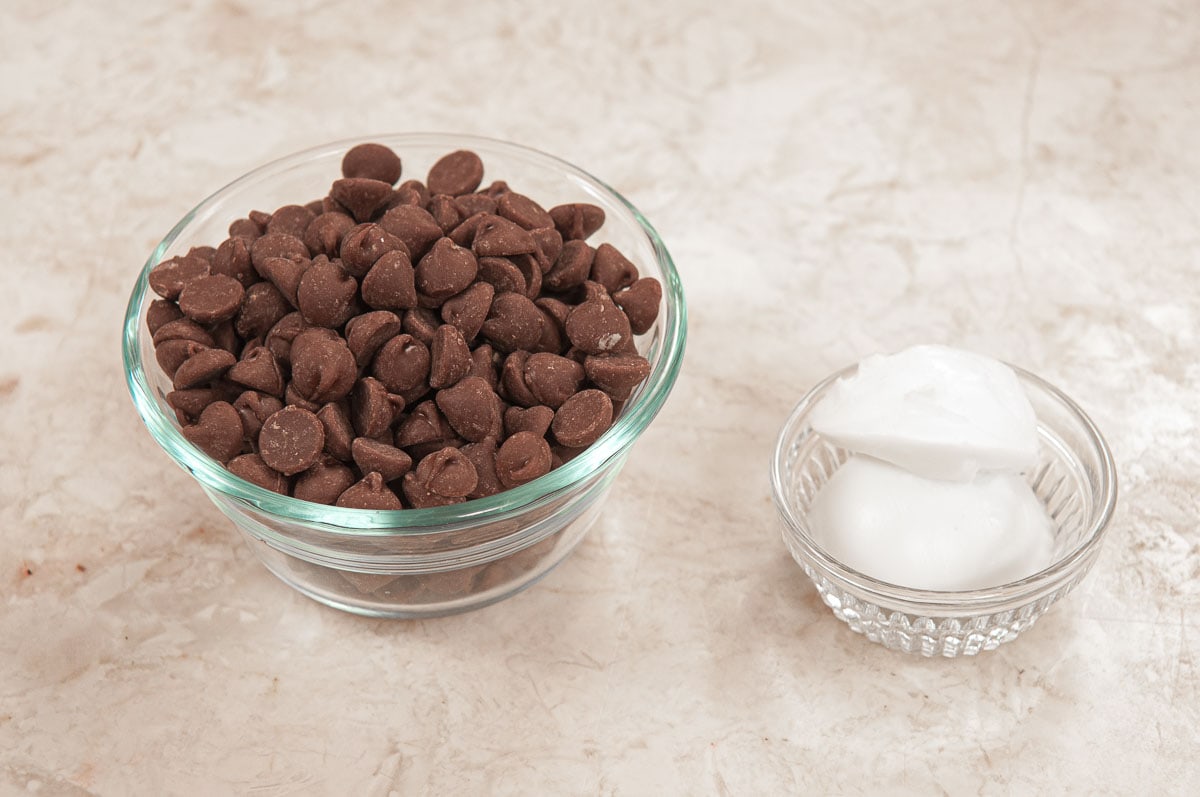 Ingredients for the chocolate glaze include a bowl of milk chocolate and a bowl of shortening